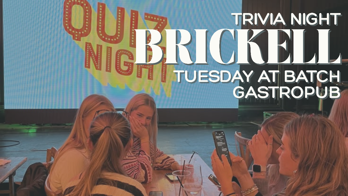 Friends playing trivia at a neighborhood bar in Brickell, Miami